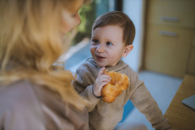 baby eating bread